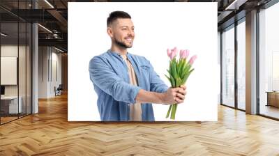 Handsome man with bouquet of beautiful flowers on white background Wall mural