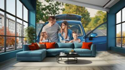 Happy family near car outdoors Wall mural