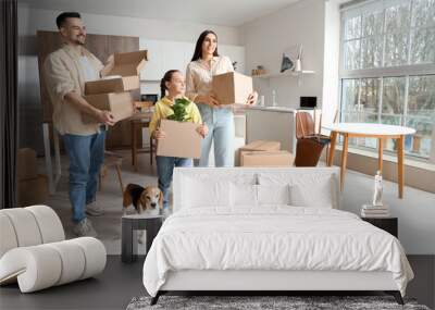 Happy family with boxes and Beagle dog in kitchen on moving day Wall mural