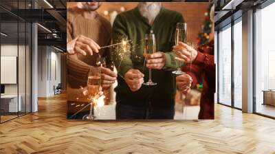 Happy family with Christmas sparklers and glasses of champagne at home Wall mural