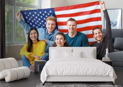 Happy friends with USA flag at home. Independence Day celebration Wall mural