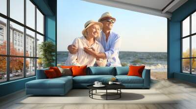 Happy mature couple at sea resort Wall mural