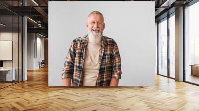 Happy mature man on grey background Wall mural