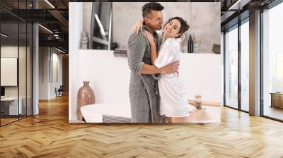 Happy young couple in bathroom at home Wall mural