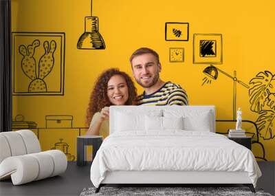 Happy young couple with key in drawn interior of their new home Wall mural