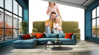 Happy young family with sofa showing thumb-up gesture on white background Wall mural