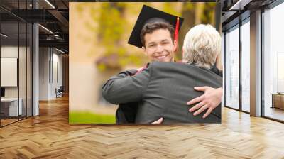 Happy young man with his father on graduation day Wall mural