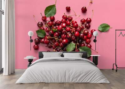 Heap of sweet cherries and leaves on pink background Wall mural