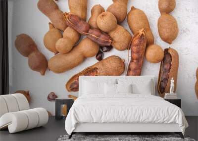 Heap of tasty tamarinds on white background Wall mural