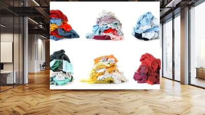 Heaps of different clothes on white background Wall mural