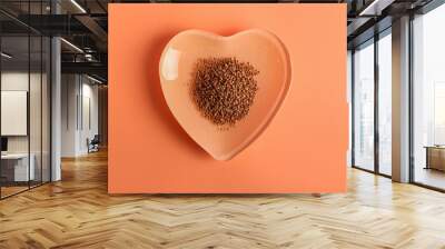 Heart shaped plate with buckwheat grains on color background Wall mural