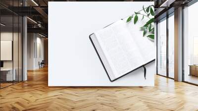 Holy Bible and branch on white background with space for text Wall mural