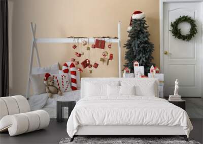 Interior of children's room with bed, Advent calendar and Christmas tree Wall mural