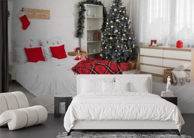 Interior of festive bedroom with Christmas tree and decor Wall mural