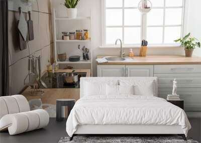 Interior of light kitchen with white counters, silver sink and shelving unit Wall mural