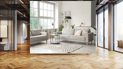 Interior of light living room with cozy grey sofas, coffee table and big window Wall mural