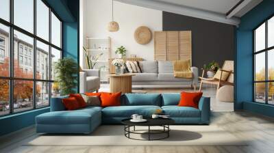 Interior of light living room with grey sofas, wooden armchair and coffee table Wall mural