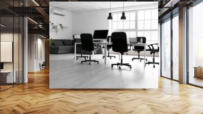 Interior of light office with table, chairs and sofa Wall mural