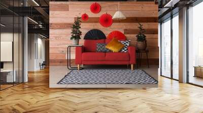 Interior of living room decorated for chinese New Year celebration with red sofa and fir trees Wall mural