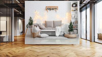 Interior of living room with Christmas trees, couch and glowing lights Wall mural