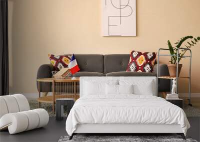 Interior of living room with French flag on table and sofa Wall mural