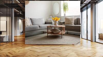 Interior of modern living room with cozy sofas and flower vase on coffee table Wall mural