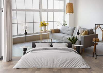 Interior of modern living room with mimosa flowers in vase and sofa Wall mural