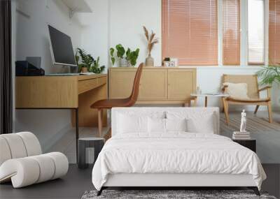 Interior of office with workplace, drawers and green houseplants Wall mural