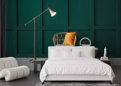 Interior of room with wicker chair, floor lamp and table Wall mural