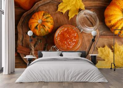 jar of sweet pumpkin jam on wooden background Wall mural