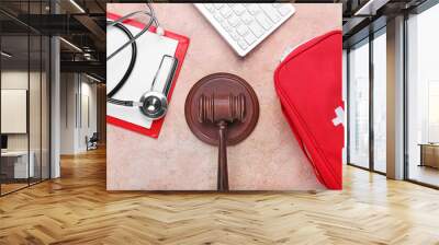 Judge gavel, PC keyboard, stethoscope, clipboard and first aid kit on color background. Concept of health care reform Wall mural