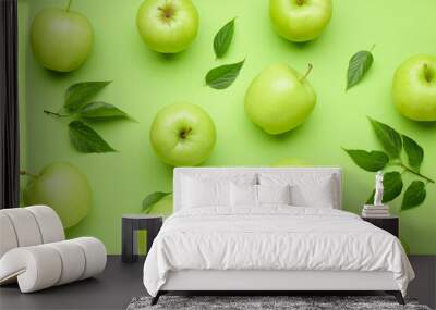 Juicy ripe apples on green background Wall mural