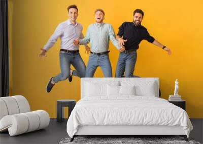 Jumping young men on color background Wall mural