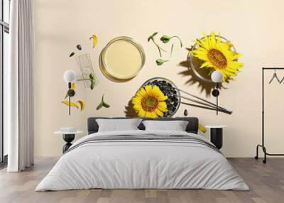 Laboratory glassware with sunflowers, seeds and sprouts on beige background Wall mural