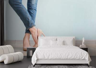 Legs of young woman in stylish high heels indoors Wall mural