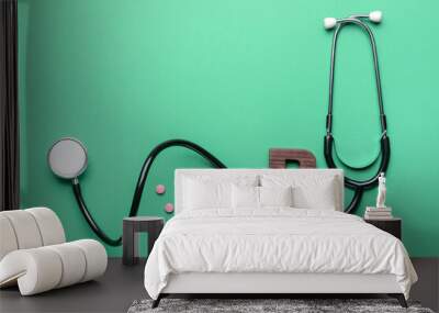 Letter B with stethoscope and pills on color background Wall mural