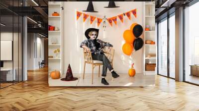 Little boy celebrating Halloween at home Wall mural