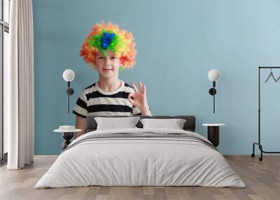 Little boy in funny disguise on color background. April fools' day celebration Wall mural