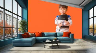 Little boy with Bible on color background Wall mural