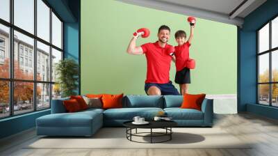 Little boy with boxing trainer near green wall Wall mural