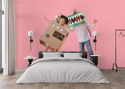 Little children in cardboard costumes on pink background Wall mural