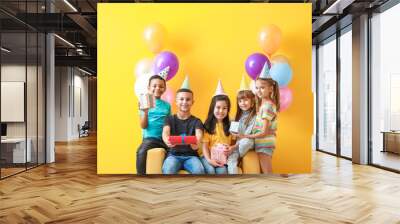 Little children with Birthday gifts and air balloons on color background Wall mural