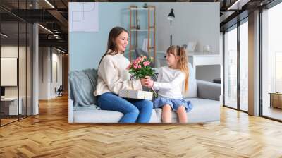 Little daughter greeting her mother at home Wall mural