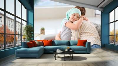 Little girl after chemotherapy with her mother at home Wall mural