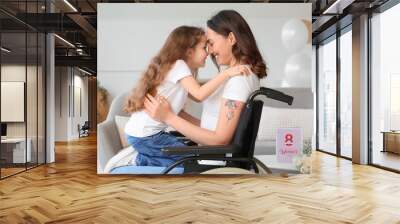 Little girl and her mother in wheelchair on International Women's Day at home Wall mural