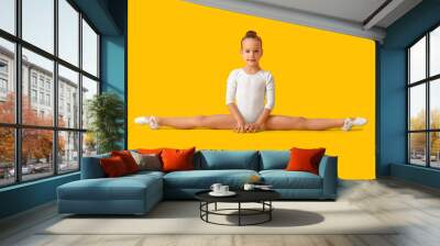 Little girl doing gymnastics on color background Wall mural