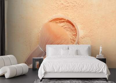 Makeup brush and loose powder on light background Wall mural