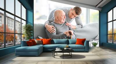 Male caregiver with senior man in nursing home Wall mural