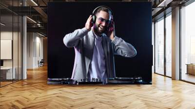 Male DJ playing music in club Wall mural