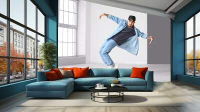 Male hip-hop dancer in studio Wall mural